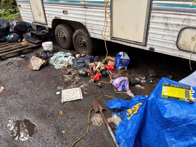 Man Arrested After Sewage, Trash Found Leaking Into Creek at Illegal Campsite in Oregon
